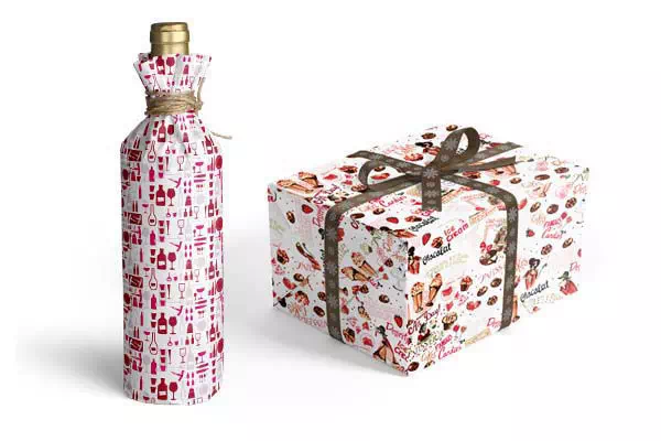 bouteille et cadeau rectangulaire emballés dans du papier cadeau à motif pour caviste et chocolatier